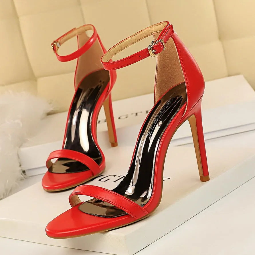 Women's open-toe high heels with an ankle-strap buckle in multiple colour options.