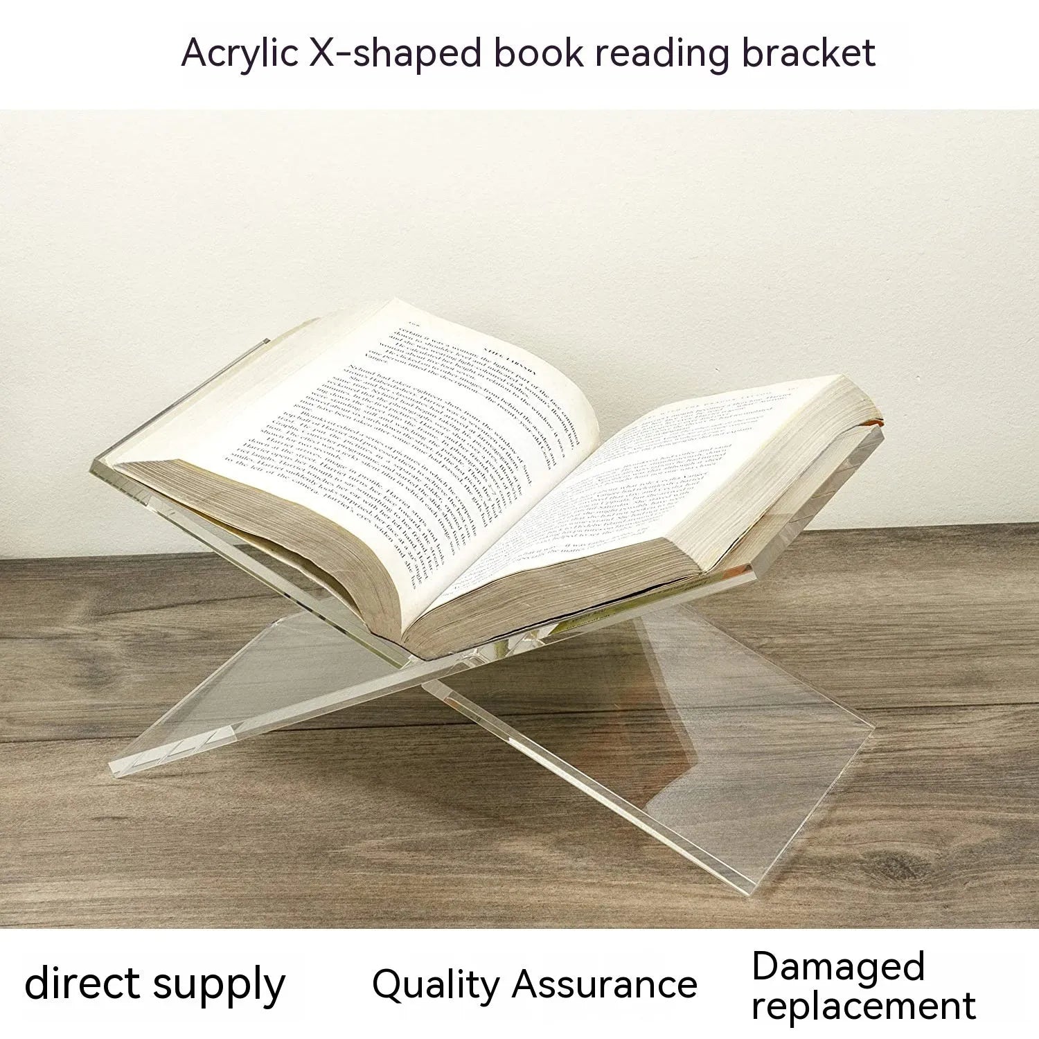 Clear acrylic X-shaped book reading rack displaying hardback books on a wooden desk