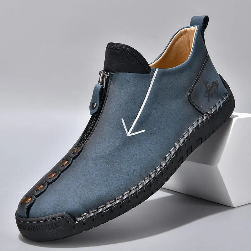 Men's brown leather-look martin boots with a front zipper and round toe on a rubber sole.