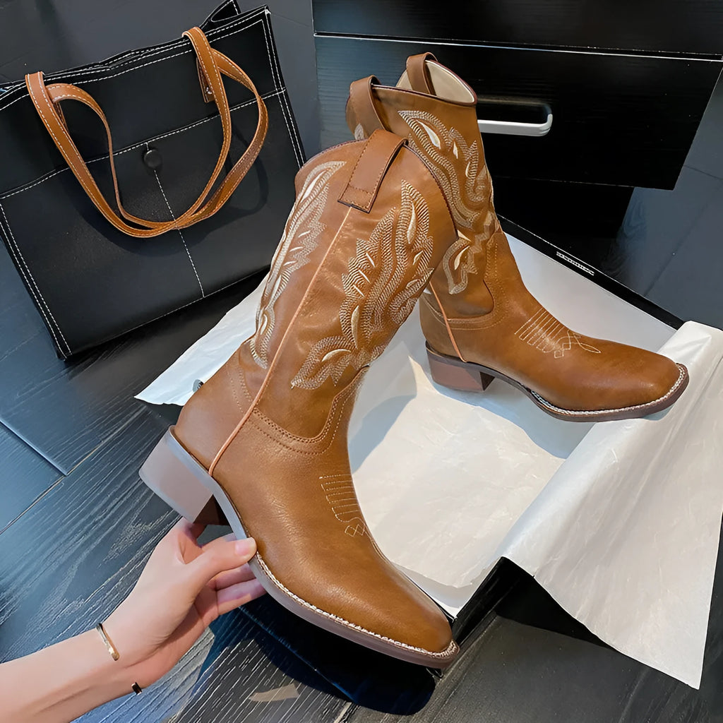 Brown women's embroidered mid-calf Martin boots on a white background, showing round toe and low square heel.