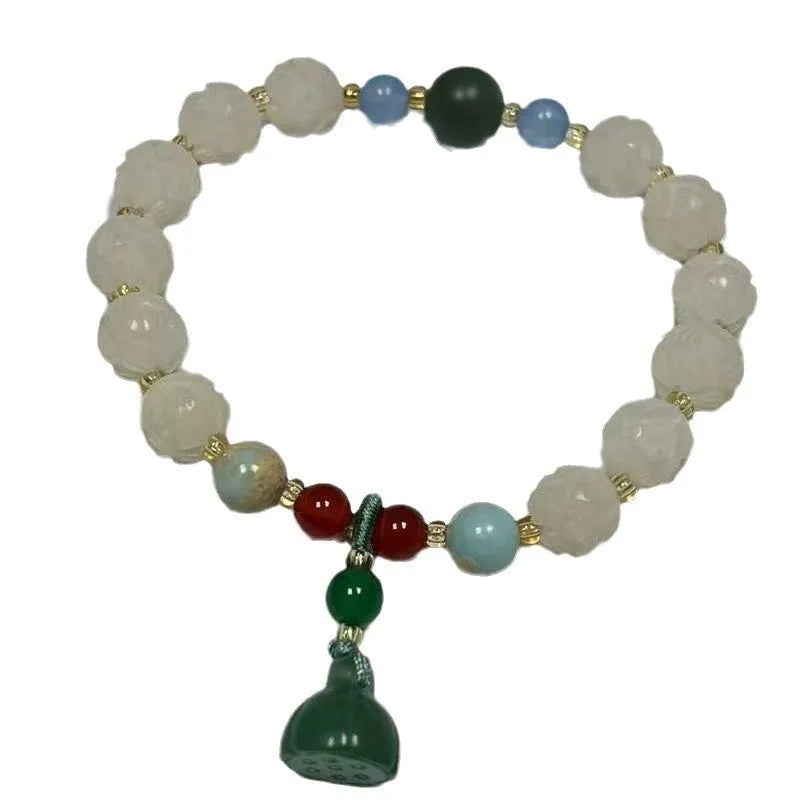 Bodhi root bracelet with carved lotus, pumpkin, and white jade beads in multiple sizes