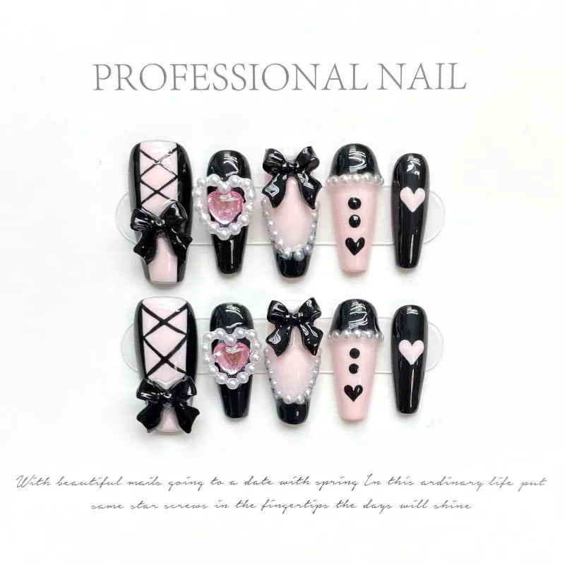 Black and pink heart hand-painted artificial nail set with cat's eye design in four sizes