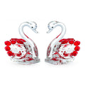 Clear crystal swan desktop ornament on a wooden surface