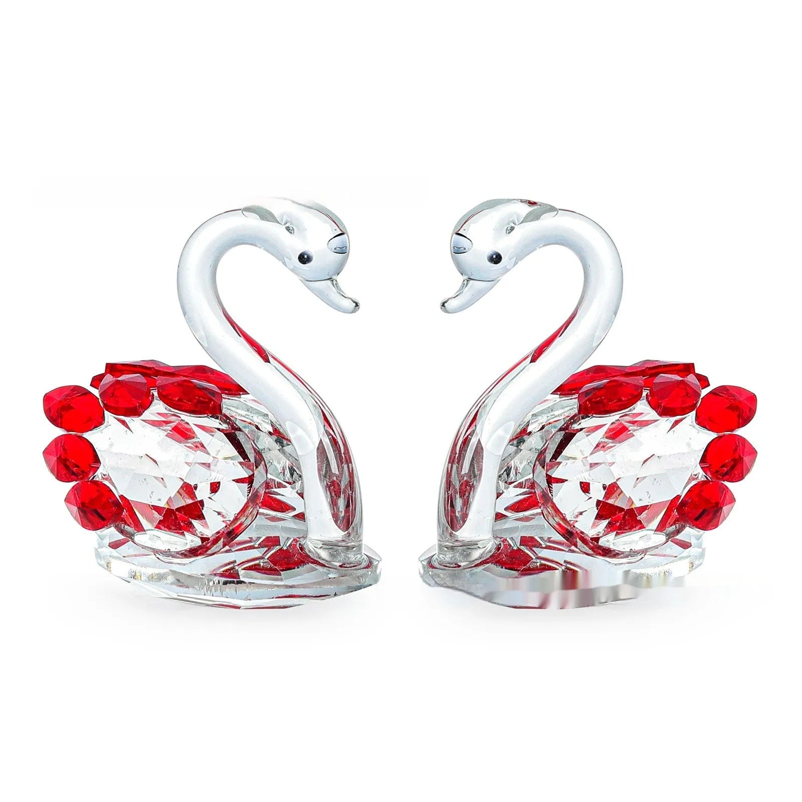 Clear crystal swan desktop ornament on a wooden surface