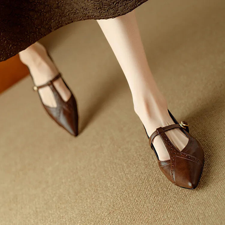 Brown leather women's low-cut flat shoes with round toe and mid heel on a white background.