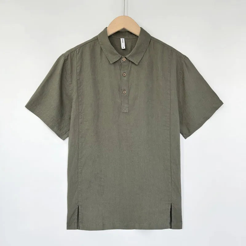 Man wearing a loose-fitting grey green linen top with thin lapels and short sleeves