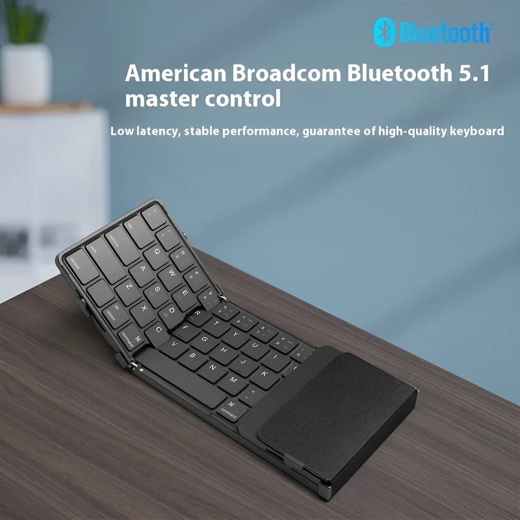 Black folding Bluetooth keyboard for mobile phones and tablets showing compact folded size
