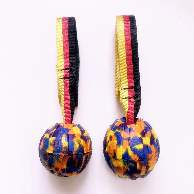 Floating EVA water training ball for dogs in camouflage and yellow colours showing different size options