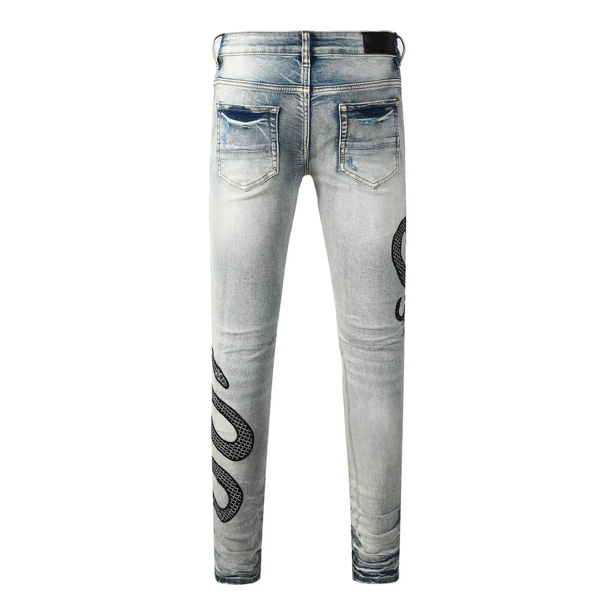 Blue distressed wash skinny jeans with a button fly and elasticated mid-rise waistband on a mannequin.