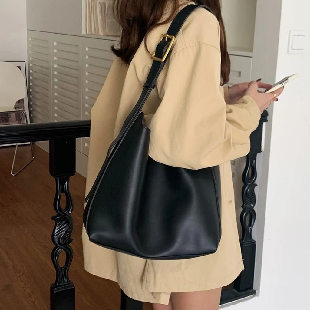 Women's black PU leather shoulder bag with swing thread design and adjustable strap
