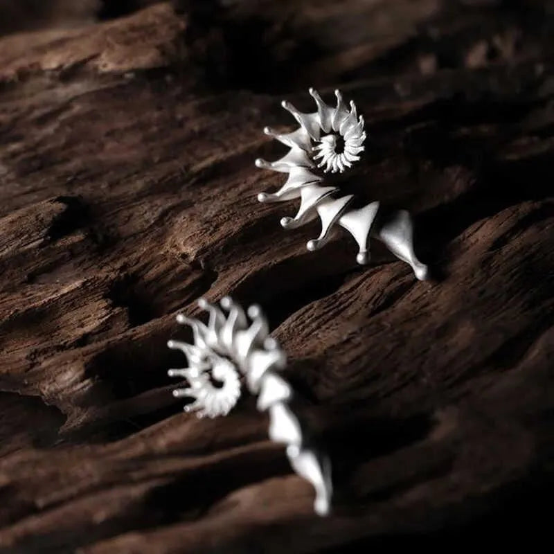 Three-dimensional conch stud earrings with matte finish and irregular design
