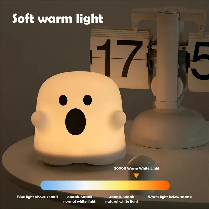 Silicone night light in Ah Ah style on a bedside table with soft glow