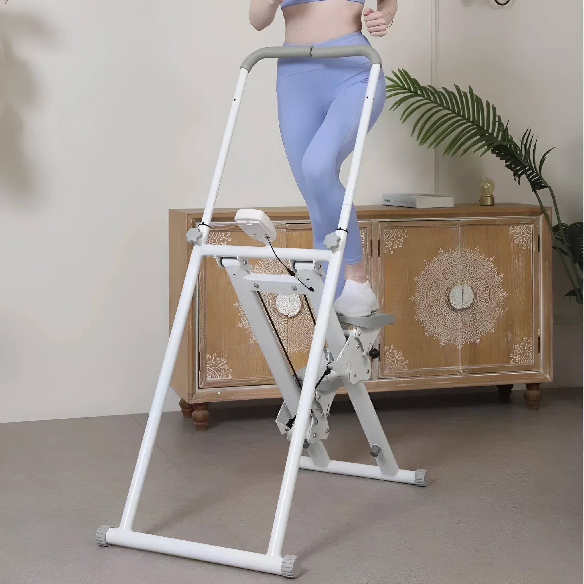 White foldable treadmill with attached climbing frame for home fitness