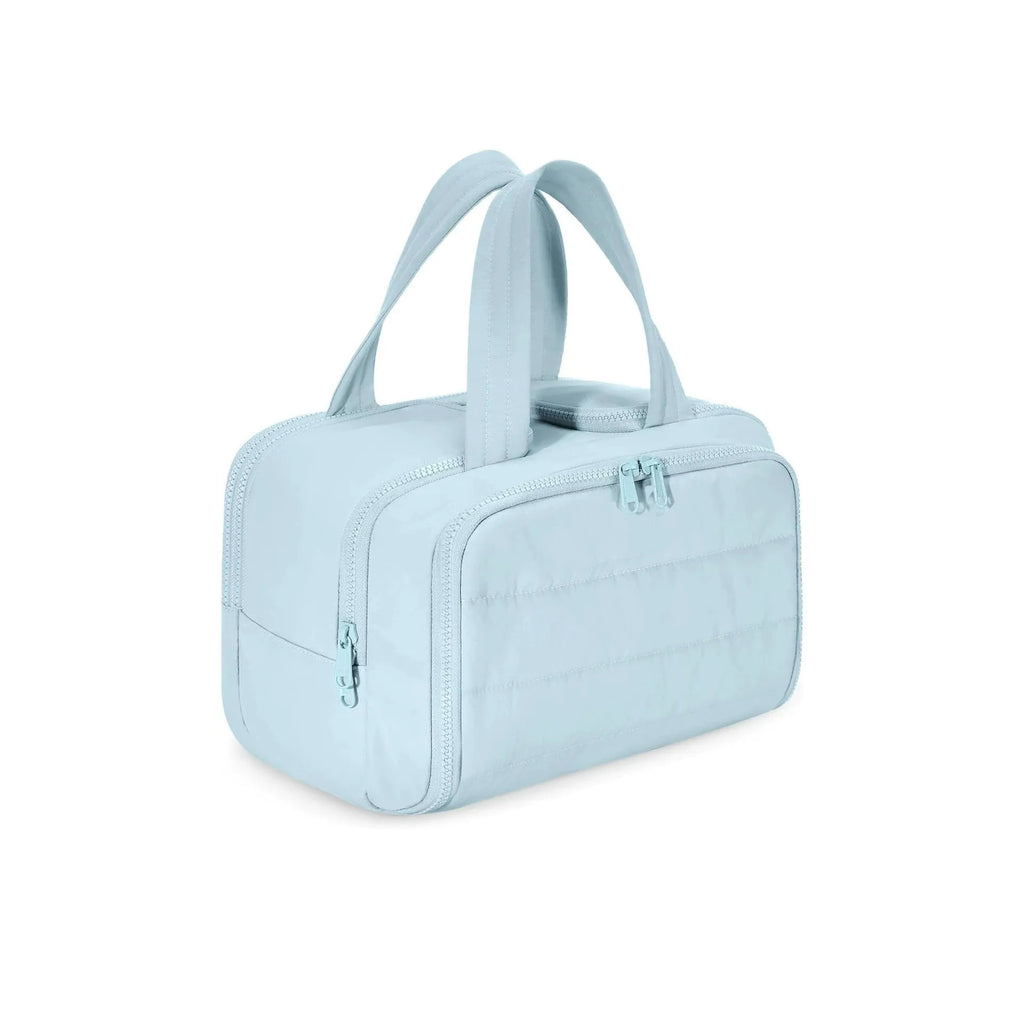 Large lightweight polyester travel toiletry bag with wide opening in beige colour on a neutral background.
