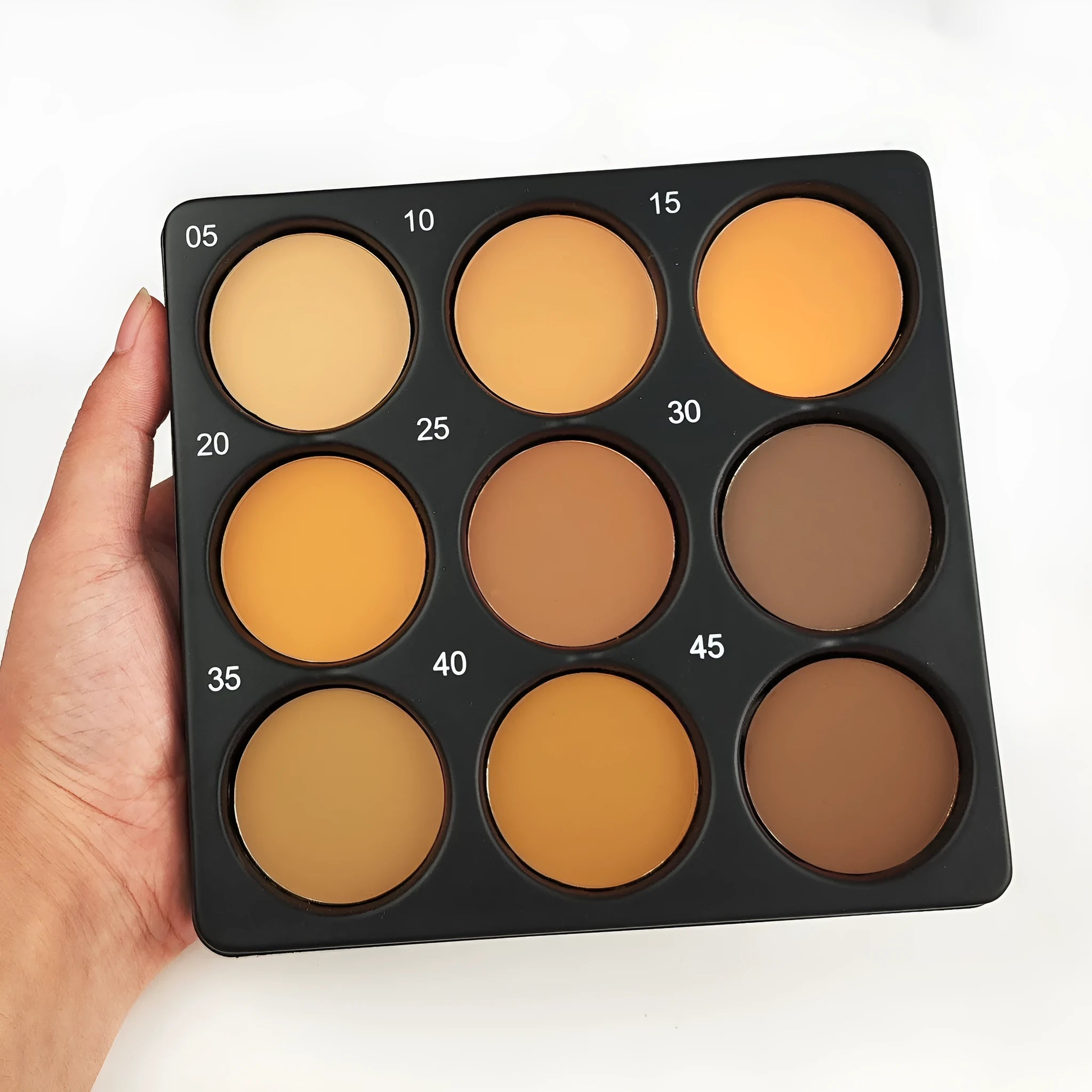 Dark matte makeup palette with nine waterproof colours and a repair disk.