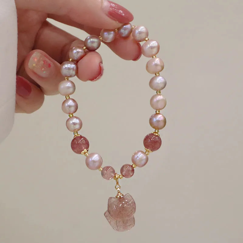 Women's natural freshwater pearl bracelet with light pink pearl, strawberry quartz, and fox charm on string