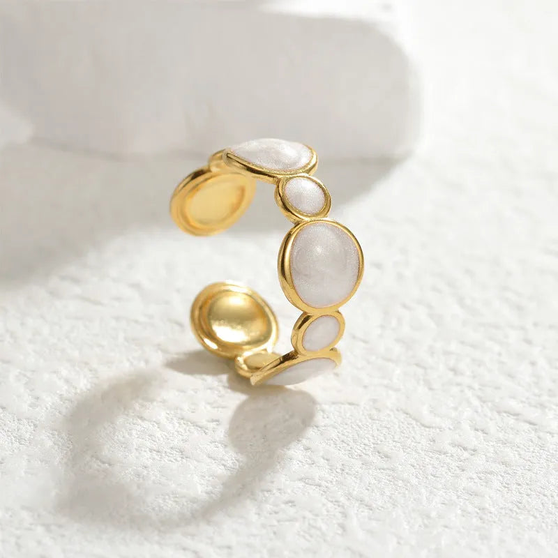 Geometric stainless steel ring with adjustable opening and electroplated finish