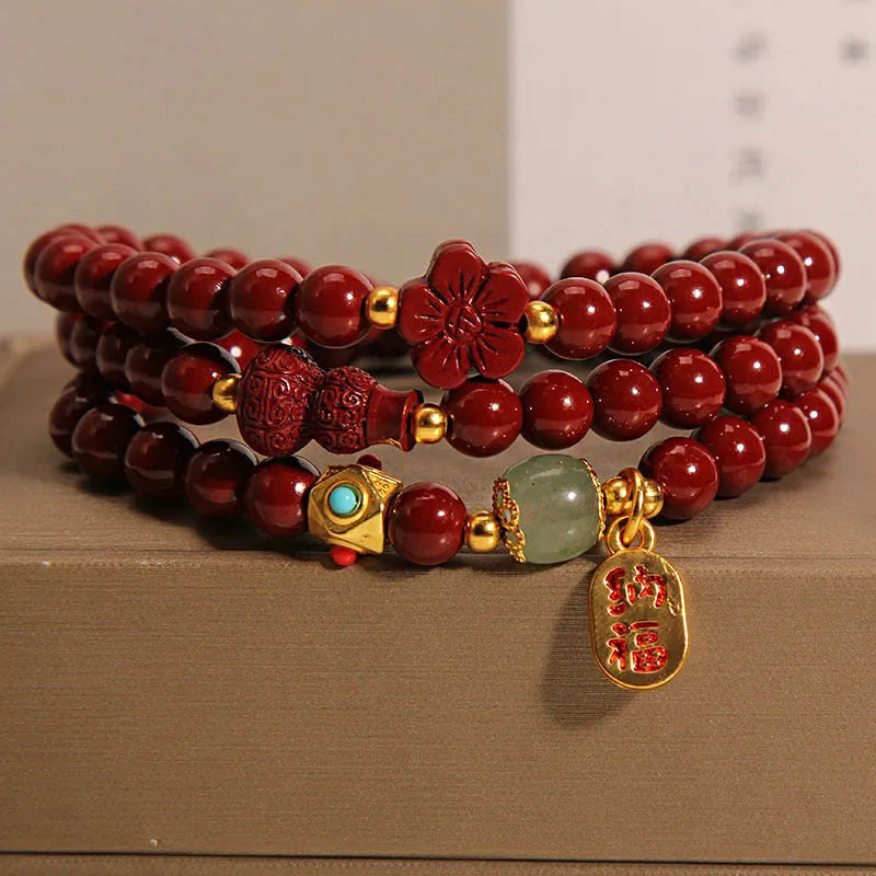 Multi-circle cinnabar bracelet with gourd and five petal flower motifs, polished finish, 6mm beads