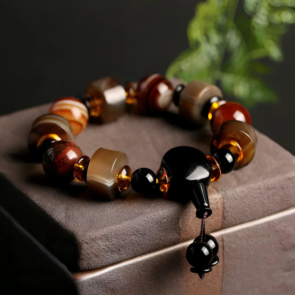 Natural twining line old agate bracelet with sardonyx agate abacus beads and white and red agate spacer beads on neutral background