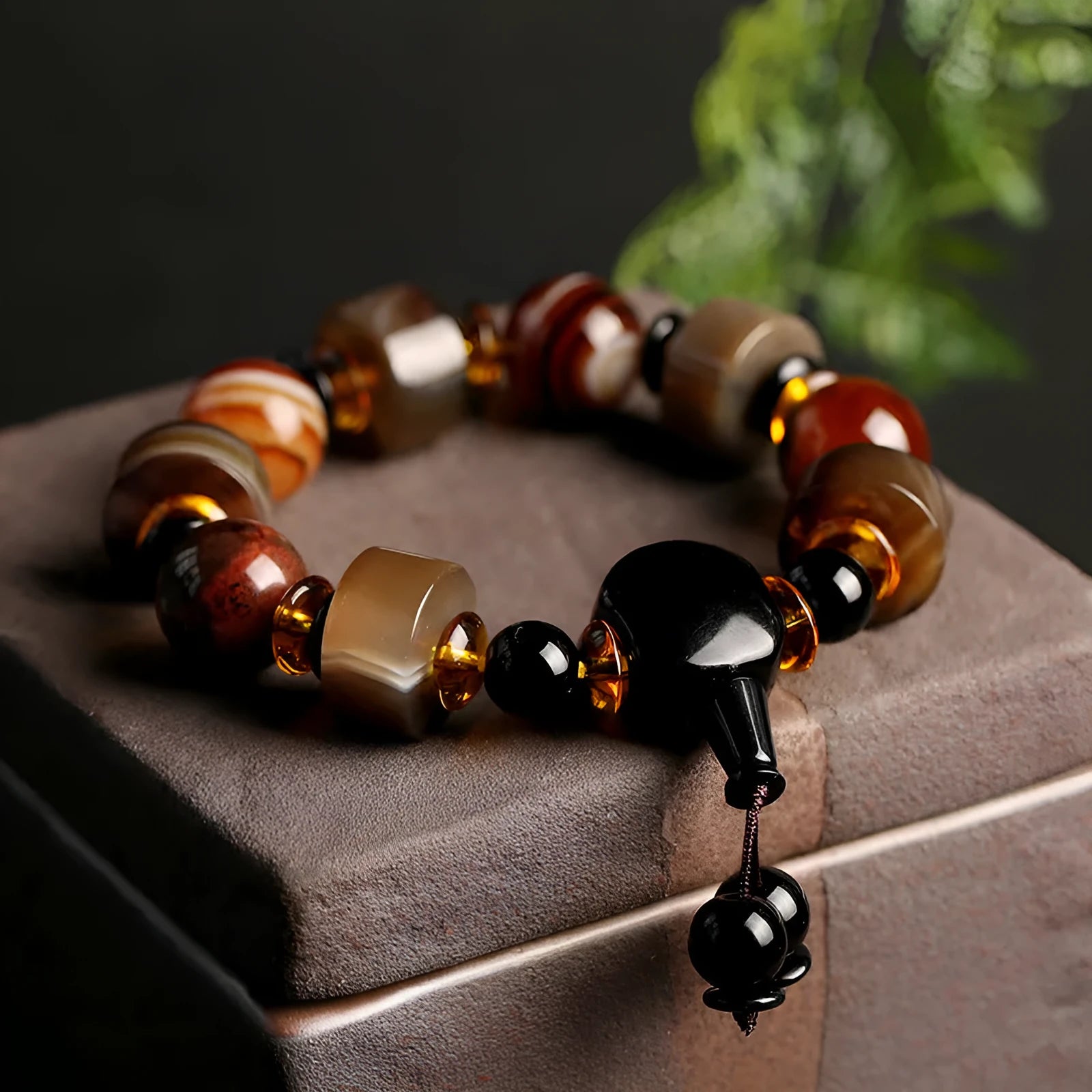 Natural twining line old agate bracelet with sardonyx agate abacus beads and white and red agate spacer beads on neutral background