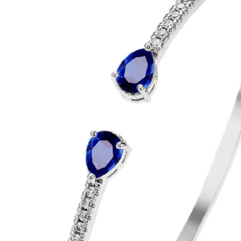 Copper bracelet with multi-zircon inlay in blue or white colour options