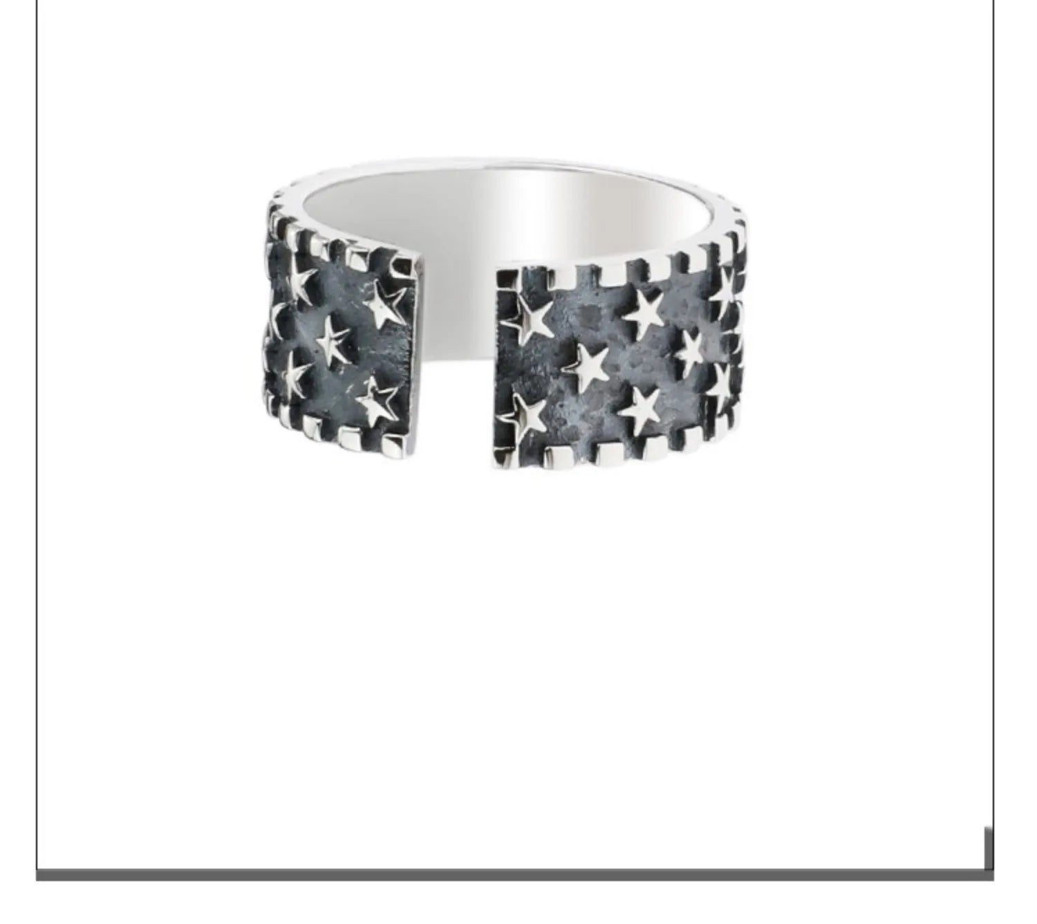 Adjustable open-band sterling silver ring with a raised five-pointed star geometric design.