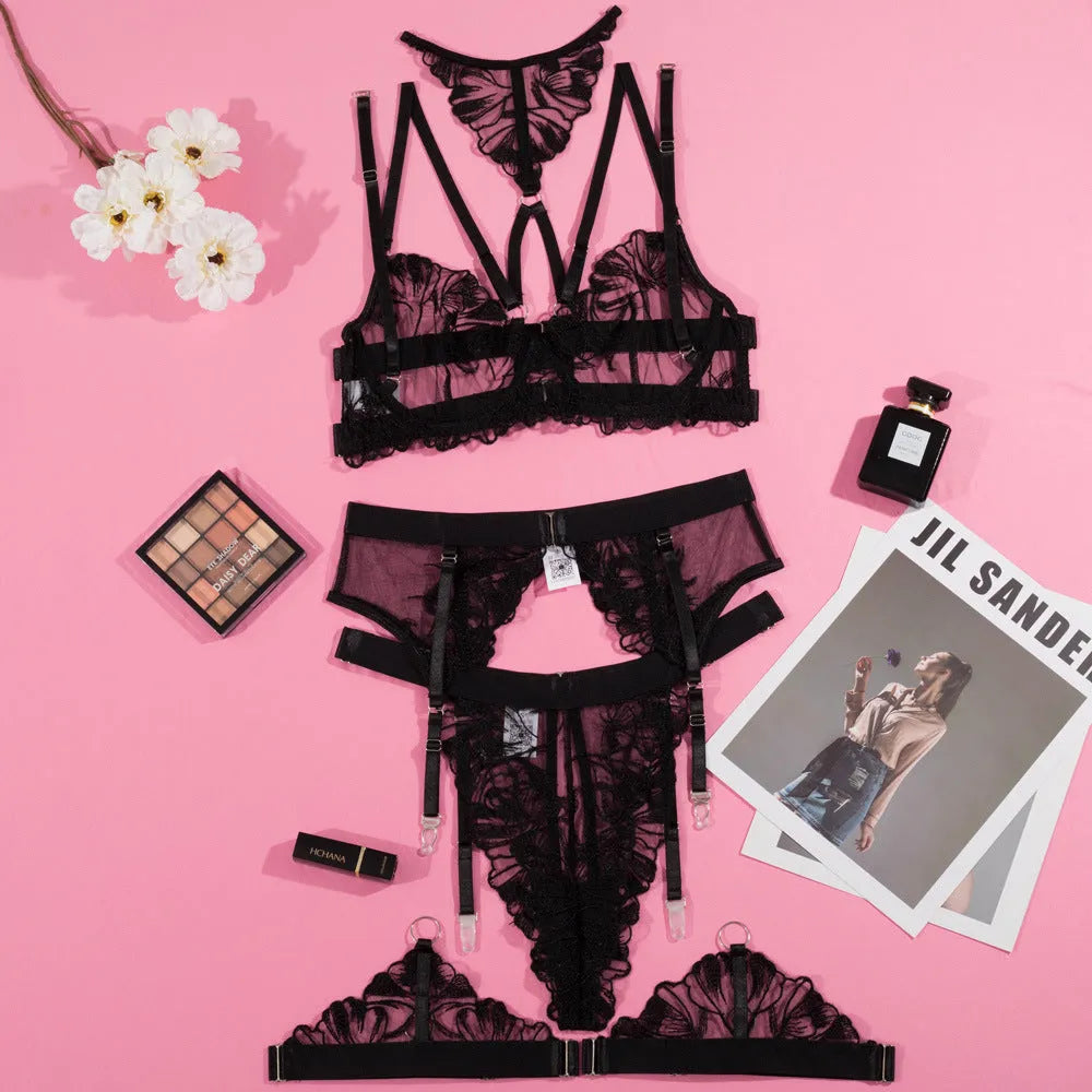 Black women's bikini set with embroidery detail on a mesh bra and matching briefs.