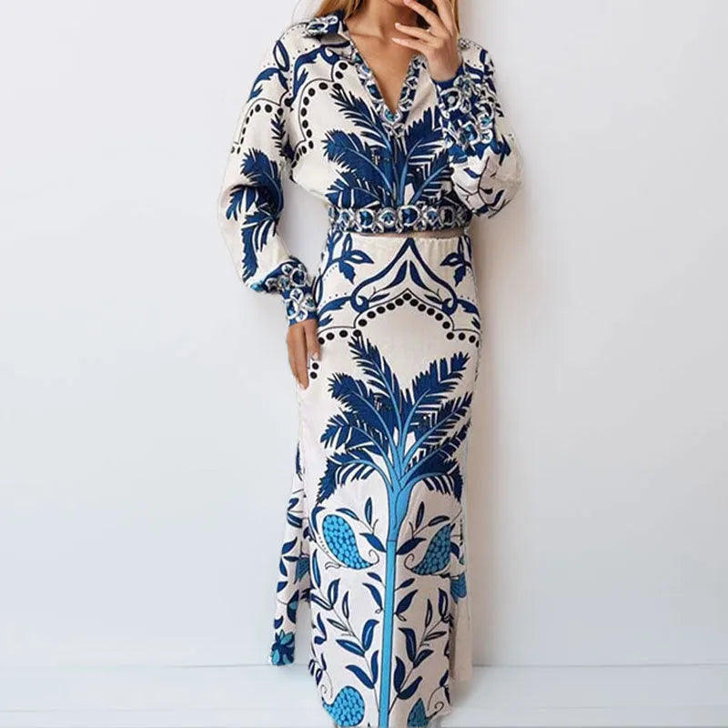 Women's floral print polyester co-ord set with long sleeves and a long skirt on a hanger.