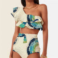 White women's one-shoulder swimsuit with large lotus leaf design and split bikini bottom