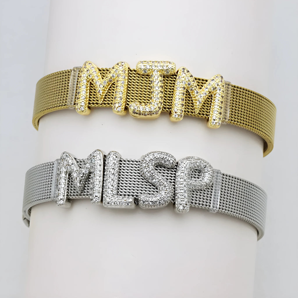 Retro trend copper letter bracelet with micro inlaid zirconium in gold finish on white background