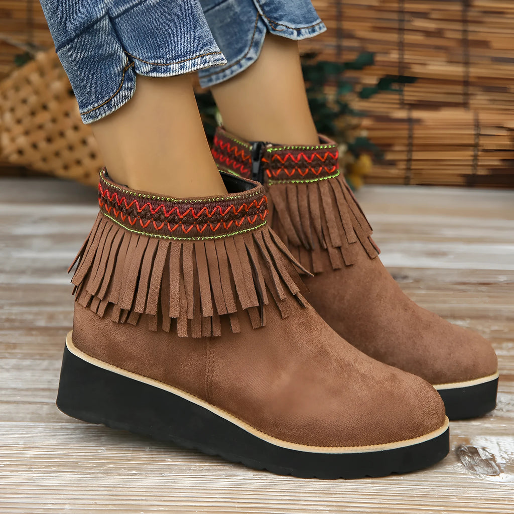 Women's suede wedge booties with side zipper, thick rubber sole, and tassel detail in black colour