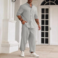 Men's casual cotton linen short-sleeved shirt and long trousers set in apricot, laid flat.