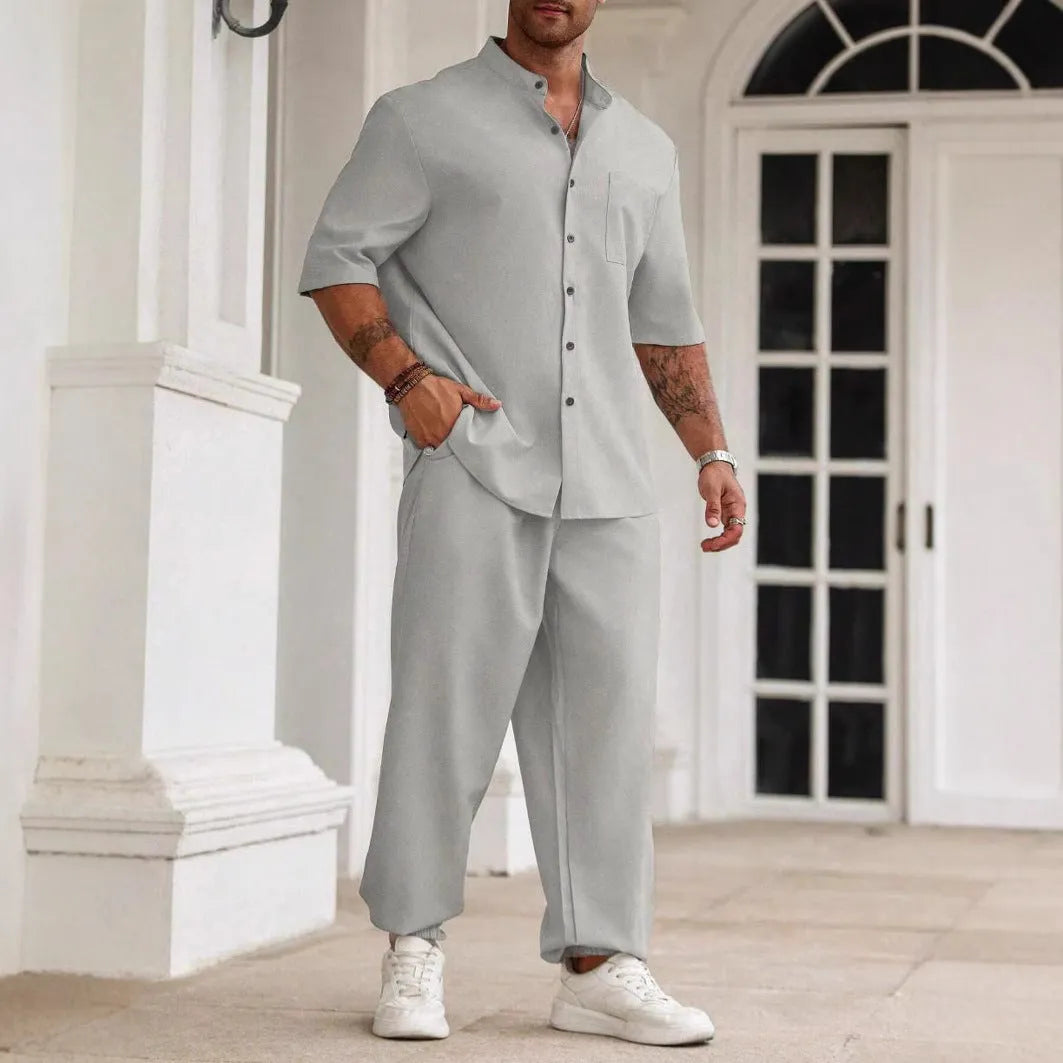 Men's casual cotton linen short-sleeved shirt and long trousers set in apricot, laid flat.