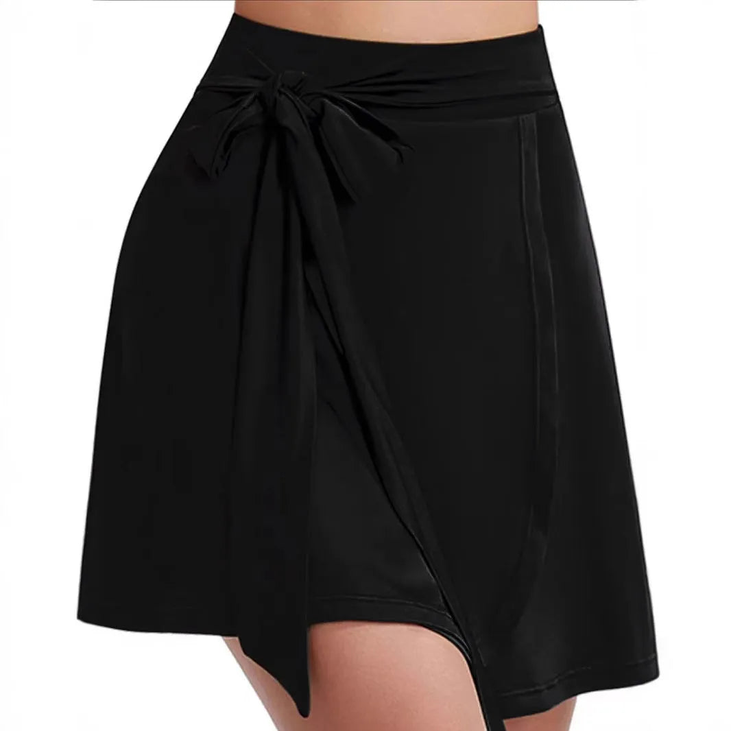Black thigh-length anti-exposure sports skirt with high waist, built-in shorts, and shoulder strap details
