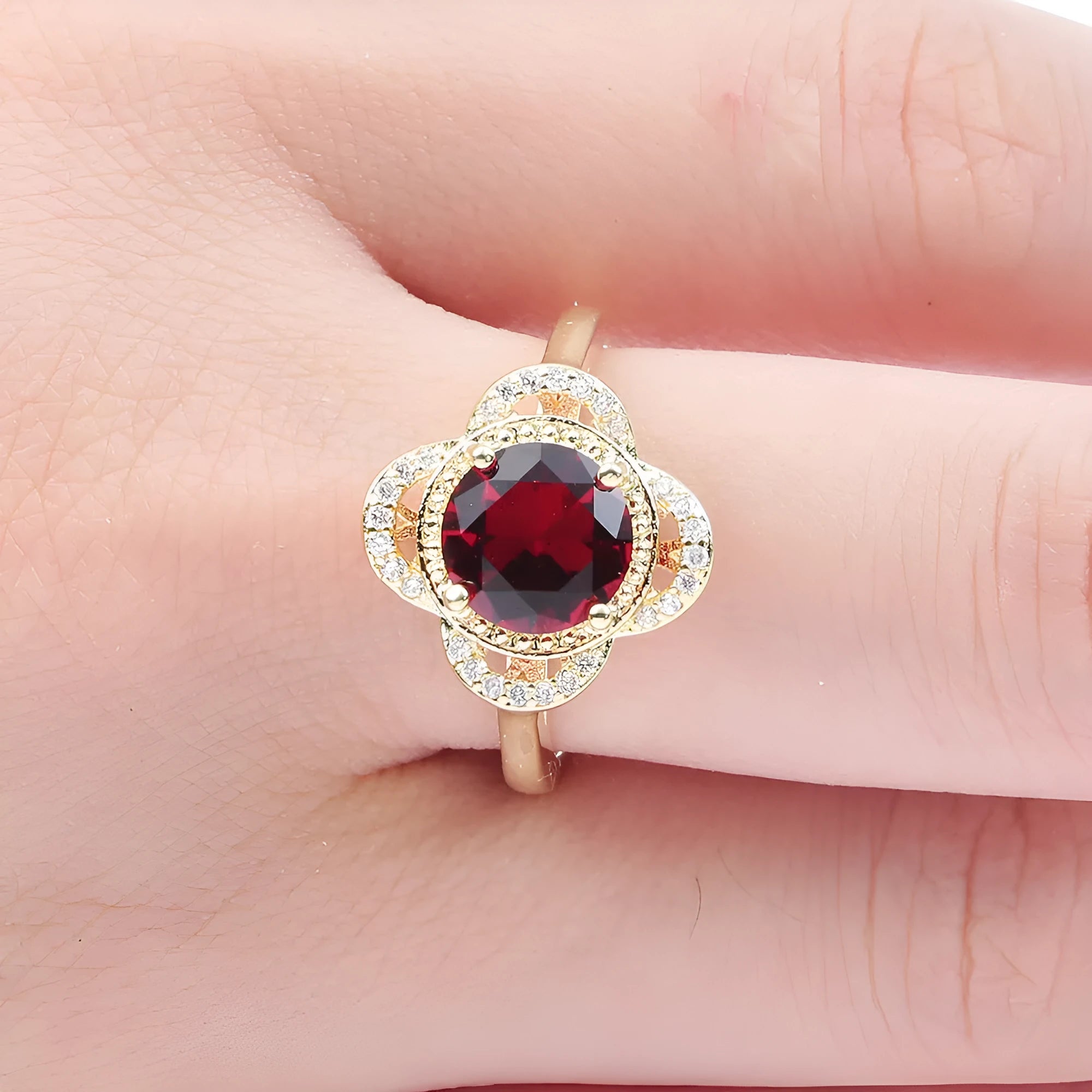 Copper fruit-shaped zircon ring for men and women on a plain background.