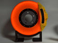 Rechargeable brake disc LED night light with touch dimmer, blue caliper colour, on a desk