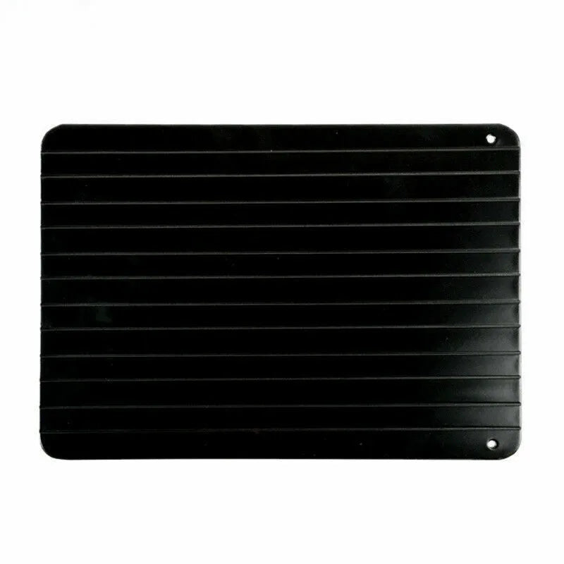 Black aluminium fast defrost tray 23x16.5cm on a countertop