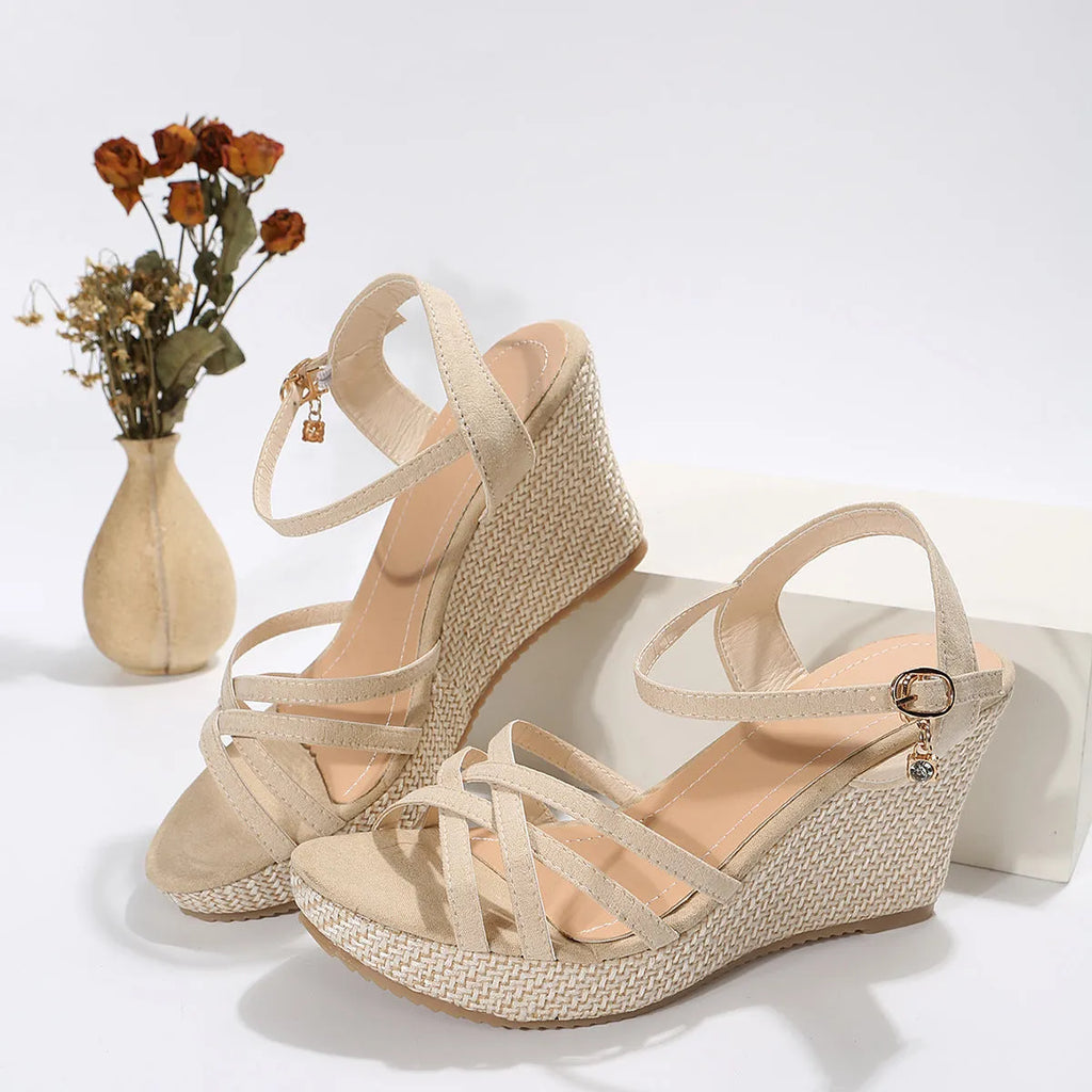 Women's black wedge sandals with a fish mouth open toe and cloth upper.
