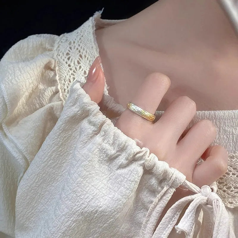 White copper open mouth ring with Xiangyun pattern and silver gold electroplated finish.