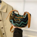 Women's straw woven crossbody bag with single strap and textured knitted appearance
