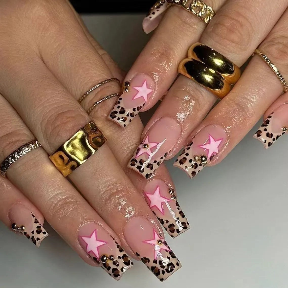Wear Armor French leopard print five-pointed star press-on nails with pearl and diamond accents