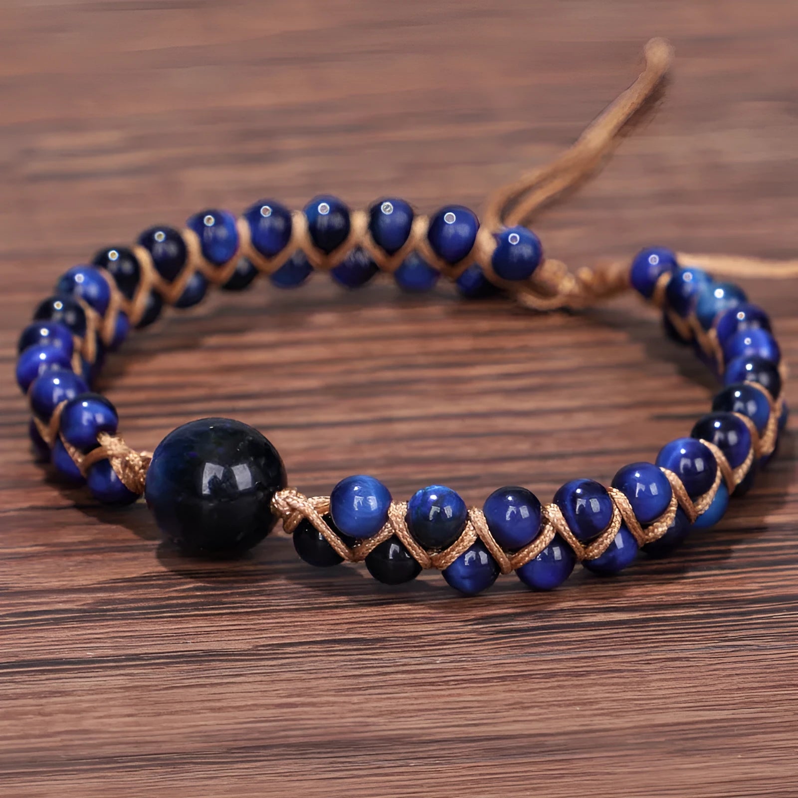 Hand-woven Tigereye gemstone pull bracelet showing geometric pattern and natural stone texture