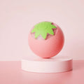 Electric rolling ball toy for dogs and cats in green, pink, and yellow on a light background