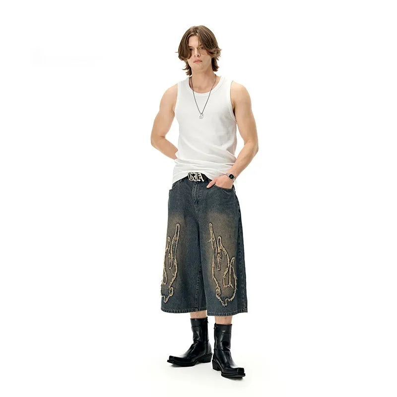 Men's cropped denim shorts with patch flame embroidery in black colour, straight leg summer design