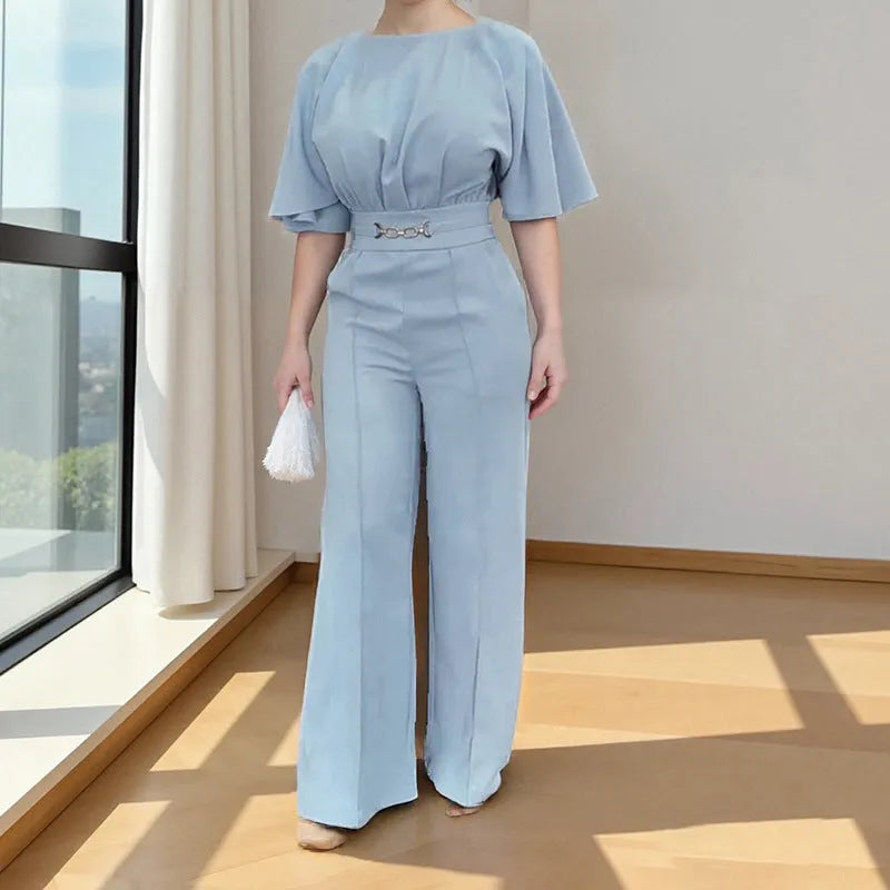 Blue polyester casual suit set with long sleeve top and trousers on a hanger