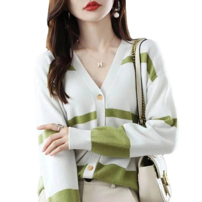 Women's black and white 3D striped knitted cardigan with button front and V-neck on a slim fit.