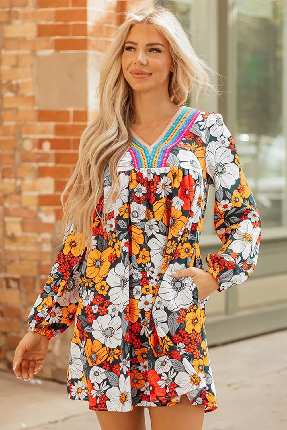 Orange floral print striped lace V-neck long sleeve mini dress on mannequin
