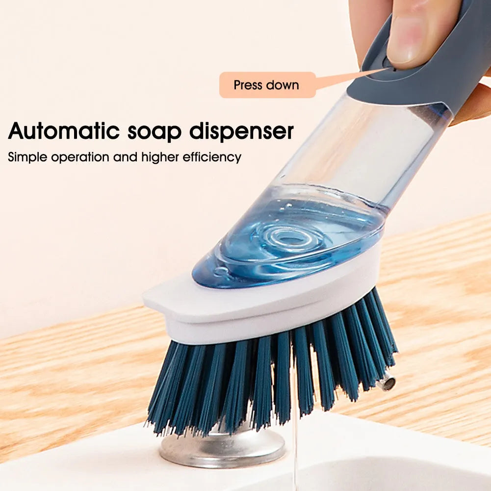 Multifunctional dish brush with soap dispenser, long handle, scouring block and sponge, in blue colour on a kitchen counter