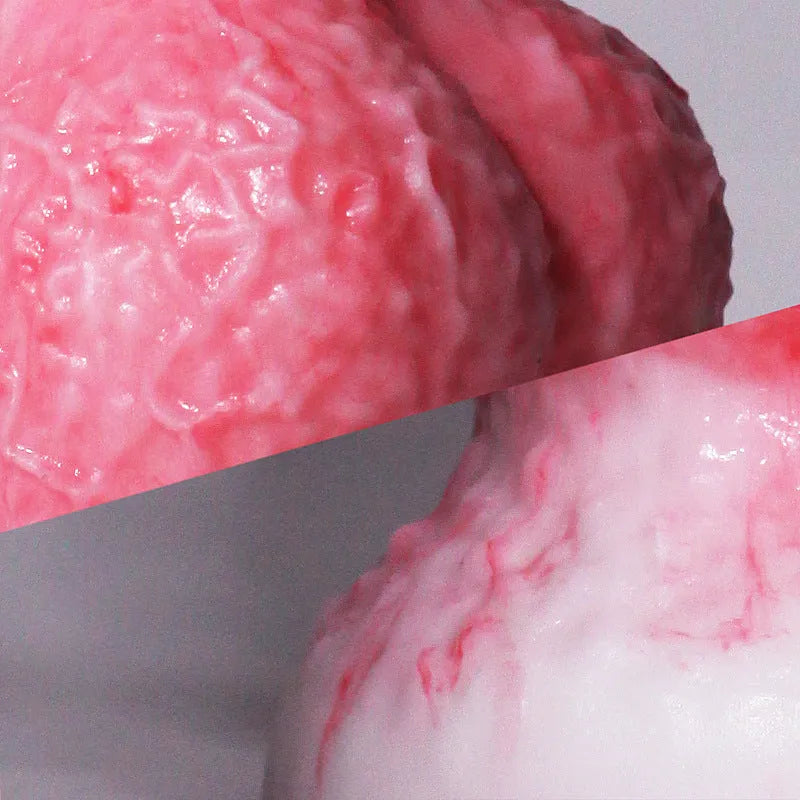 Pink Berserker shaped penis masturbation device made from platinum silicone.