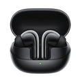 Black active noise reduction true wireless Bluetooth headset with charging case on a flat surface